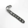 Anterolateral Distal Tibia Locking Plate in a silver-colored, reflective metal, seen from above with a curved head of clustered holes and the letter L marked near the end of the long shaft.