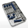 Second sterilization tray of the spinal fixation instrument set, showing ball-tip probes with blue handles, a surgical mallet, T-handle wrench, and related instruments
