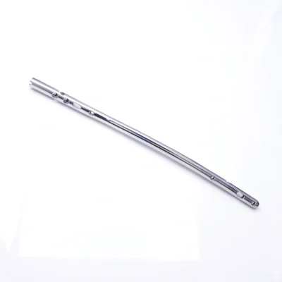 Silver-coloured Sirus Femoral Nail shown diagonally with round and elongated openings.