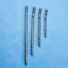 Four silver-coloured Supracondylar Nail (IMSC) implants in different lengths arranged on blue cloth.